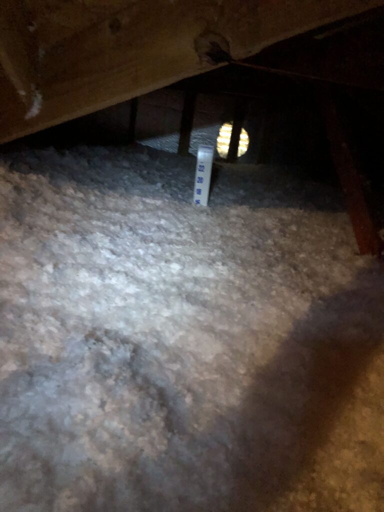 Insulation depth marker in loose-fill attic insulation